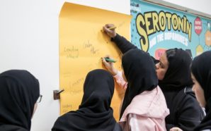 Girls writing on white board image